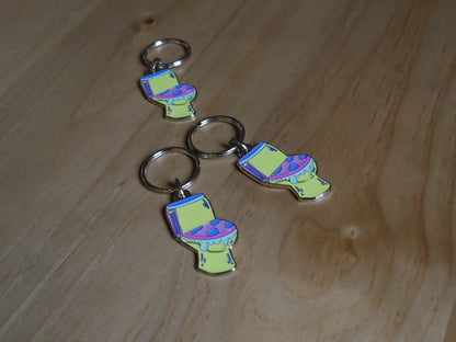 Porté-clés toilettes "Les larmes des ouin-ouins" en émail avec attache métal