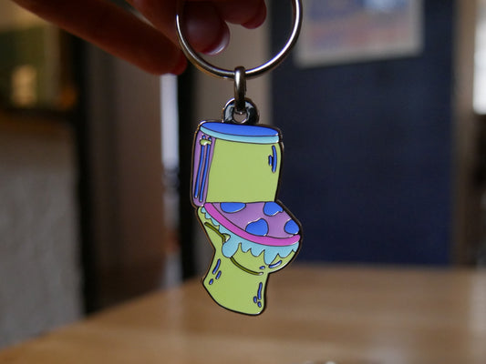 Porté-clés toilettes "Les larmes des ouin-ouins" en émail avec attache métal